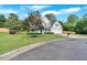 Charming two-story home featuring a lush front lawn, beautiful landscaping, and a two-car garage at 3957 Marquette Nw Way, Kennesaw, GA 30144