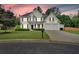 Elegant two-story home with a well-kept lawn, inviting front porch, and two-car garage at 3957 Marquette Nw Way, Kennesaw, GA 30144