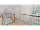 Second floor hallway with wooden banister and decorative light fixture at 3957 Marquette Nw Way, Kennesaw, GA 30144