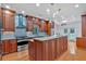 Gourmet kitchen with custom cabinets, granite countertops, and stainless-steel appliances for modern cooking at 3957 Marquette Nw Way, Kennesaw, GA 30144
