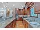 Large kitchen with ample granite counter space, stainless appliances and wood cabinetry at 3957 Marquette Nw Way, Kennesaw, GA 30144