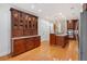 Elegant kitchen featuring hardwood floors, custom cabinetry, and stainless steel appliances at 3957 Marquette Nw Way, Kennesaw, GA 30144
