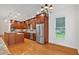 Well-lit kitchen featuring stainless steel appliances, wood cabinets and a granite island at 3957 Marquette Nw Way, Kennesaw, GA 30144
