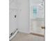 Cozy laundry room with tile floors at 3957 Marquette Nw Way, Kennesaw, GA 30144