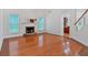 Elegant living room boasts hardwood floors, a fireplace and large windows at 3957 Marquette Nw Way, Kennesaw, GA 30144