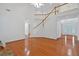 Bright living room featuring hardwood floors, grand staircase and an abundance of natural light at 3957 Marquette Nw Way, Kennesaw, GA 30144