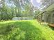 Expansive backyard featuring lush greenery and a charming porch, perfect for outdoor enjoyment at 4945 Campbellton Sw Rd, Atlanta, GA 30331