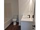 Bathroom featuring a tub and shower combination, a toilet, and a vanity with a sink at 5570 Hampton Ct, Atlanta, GA 30349