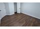 Bedroom with a closet featuring wood-look floors and neutral-toned walls at 5570 Hampton Ct, Atlanta, GA 30349