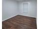 Bedroom featuring wood-look floors and a window with blinds at 5570 Hampton Ct, Atlanta, GA 30349