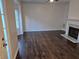 Living room featuring hardwood floors, fireplace and lots of natural light at 5570 Hampton Ct, Atlanta, GA 30349
