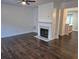 Cozy living room featuring hardwood floors, fireplace, and an open floor plan at 5570 Hampton Ct, Atlanta, GA 30349