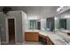 Bathroom featuring double vanity, large mirror, and tile flooring at 2819 Heritage Oaks Cir, Dacula, GA 30019