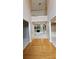 Open foyer features hardwood floors and view of living room with fireplace at 2819 Heritage Oaks Cir, Dacula, GA 30019