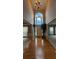 Grand foyer with hardwood floors, high ceilings, and an arched window at 2819 Heritage Oaks Cir, Dacula, GA 30019