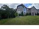 Two-story brick home with a well-manicured lawn, mature trees, and a two-car garage at 2819 Heritage Oaks Cir, Dacula, GA 30019