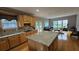 Spacious kitchen with granite countertops and stainless steel appliances adjoins seating area with lots of natural light at 2819 Heritage Oaks Cir, Dacula, GA 30019