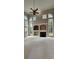 Spacious living room with high ceilings, large windows, and a black fireplace at 2819 Heritage Oaks Cir, Dacula, GA 30019