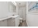 Clean bathroom featuring a vanity, mirror, shower with curtain, and modern flooring at 3123 Deshong Dr, Stone Mountain, GA 30087