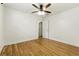 Bright bedroom featuring hardwood floors and a ceiling fan at 3123 Deshong Dr, Stone Mountain, GA 30087