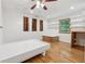 Spacious bedroom with wooden floors, natural light, built-in shelves and wooden accents at 3123 Deshong Dr, Stone Mountain, GA 30087