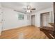 Bright bedroom with hardwood floors, ceiling fan, closet space, and natural light at 3123 Deshong Dr, Stone Mountain, GA 30087