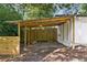 Open carport is an ideal shaded space to park your car and shield it from the elements at 3123 Deshong Dr, Stone Mountain, GA 30087