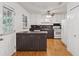 Kitchen with hardwood floors, white cabinets and stainless-steel appliances at 3123 Deshong Dr, Stone Mountain, GA 30087