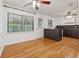 Eat in kitchen with hardwood floors, a ceiling fan and white cabinets at 3123 Deshong Dr, Stone Mountain, GA 30087