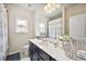 Well-lit bathroom with a spacious vanity, decorative accents, and a shower with curtain at 3755 Valleyway Rd, Cumming, GA 30040