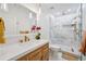 Tastefully designed bathroom features marble floors and shower, and brushed gold finishes at 3755 Valleyway Rd, Cumming, GA 30040