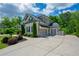 Beautiful home with a three-car garage, mature landscaping, and a spacious driveway at 3755 Valleyway Rd, Cumming, GA 30040