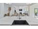 Open concept kitchen features white cabinets, quartz countertops, and stainless steel appliances at 3755 Valleyway Rd, Cumming, GA 30040