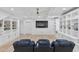 Entertainment room with custom built-ins, recessed lighting and a ceiling fan at 3755 Valleyway Rd, Cumming, GA 30040
