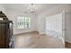 Bright office space with hardwood flooring, transom window, and modern lighting at 3755 Valleyway Rd, Cumming, GA 30040
