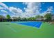 Well-maintained community tennis court with new surfacing, professional lighting, and comfortable spectator seating at 3755 Valleyway Rd, Cumming, GA 30040