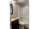Cozy bathroom with dark wood vanity, granite countertop, and shower-tub combo at 499 Oak Way, Lawrenceville, GA 30046