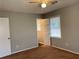 Bedroom featuring a ceiling fan and window with blinds at 499 Oak Way, Lawrenceville, GA 30046