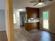 Open kitchen with breakfast bar, stainless steel appliances, vinyl floors and access to a backyard at 499 Oak Way, Lawrenceville, GA 30046