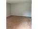 Spacious living room with neutral walls and brown carpet, offering a blank canvas for personalization at 499 Oak Way, Lawrenceville, GA 30046