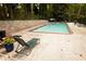 Outdoor community pool area with lounge chairs and views of mature trees at 1131 Clairemont Ave # B, Decatur, GA 30030