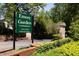 The Emory Garden condominiums entrance is marked by lush landscaping and brick pillars at 1131 Clairemont Ave # B, Decatur, GA 30030