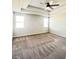 Spacious primary bedroom with neutral walls, carpeting, and natural light at 2300 Ivy Birch Ln, Buford, GA 30519