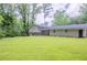 Spacious backyard with a charming brick house, offering plenty of room for outdoor fun at 3030 Golden Dr, Atlanta, GA 30344