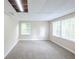 Spacious finished basement featuring plush carpet, neutral walls, and ample light from windows at 3030 Golden Dr, Atlanta, GA 30344