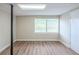 Finished basement featuring wood-look floors, light walls and ample light from window at 3030 Golden Dr, Atlanta, GA 30344
