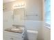 Bathroom featuring modern vanity with granite countertop, decorative mirror, and walk-in shower at 3030 Golden Dr, Atlanta, GA 30344