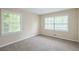 Bright bedroom featuring neutral walls, plush carpet, and natural light from the double window at 3030 Golden Dr, Atlanta, GA 30344
