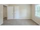 Inviting bedroom featuring a closet, carpet flooring, and natural light from the window at 3030 Golden Dr, Atlanta, GA 30344