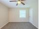Cozy bedroom featuring a ceiling fan and a large window at 3030 Golden Dr, Atlanta, GA 30344